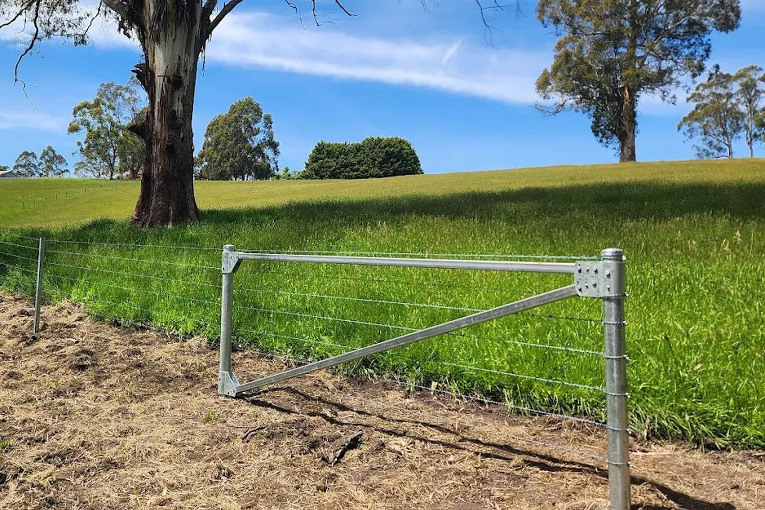 Installed FenceStay galvanised steel end assembly on a farm fence line